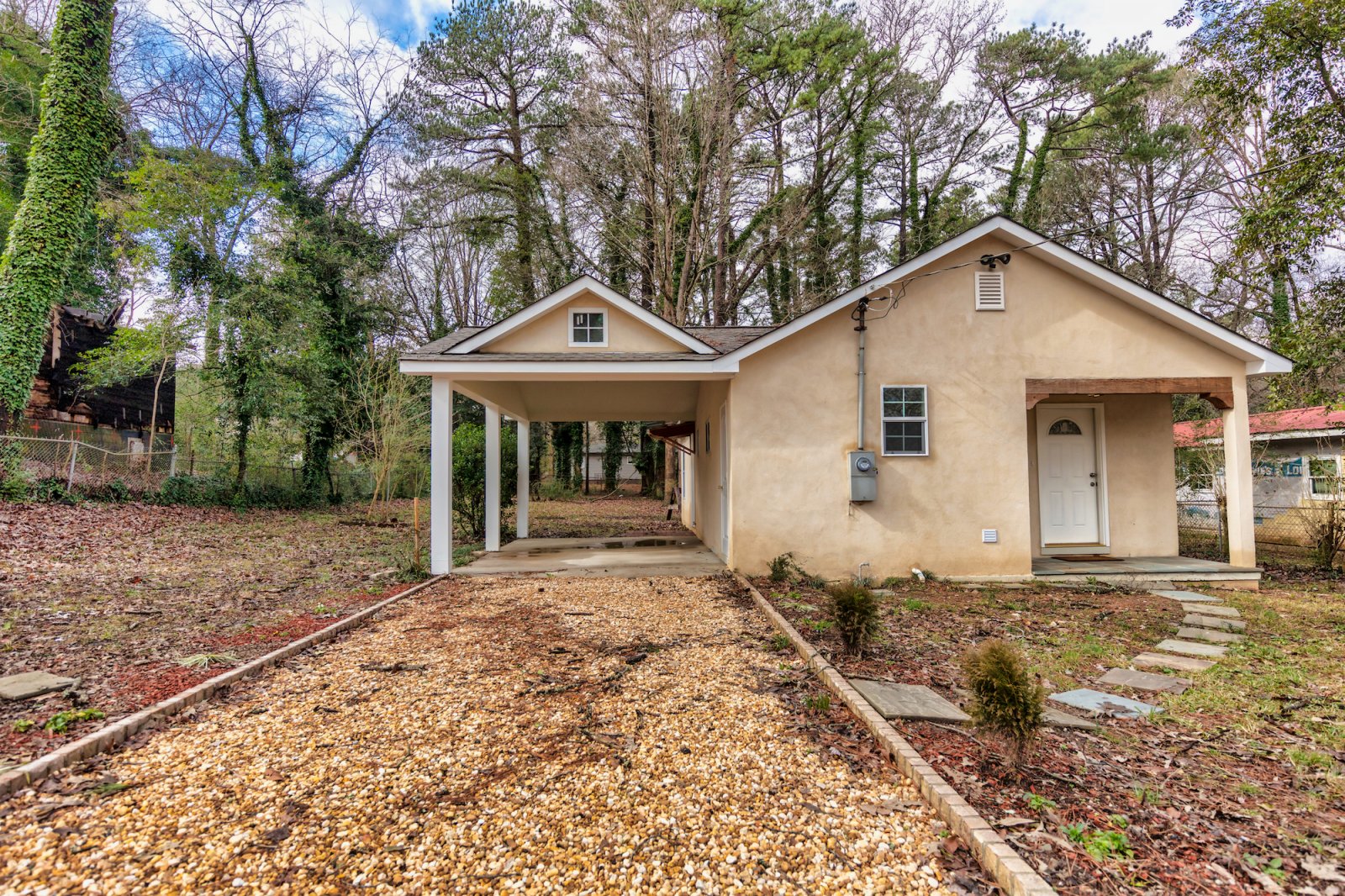 a house with trees in the background