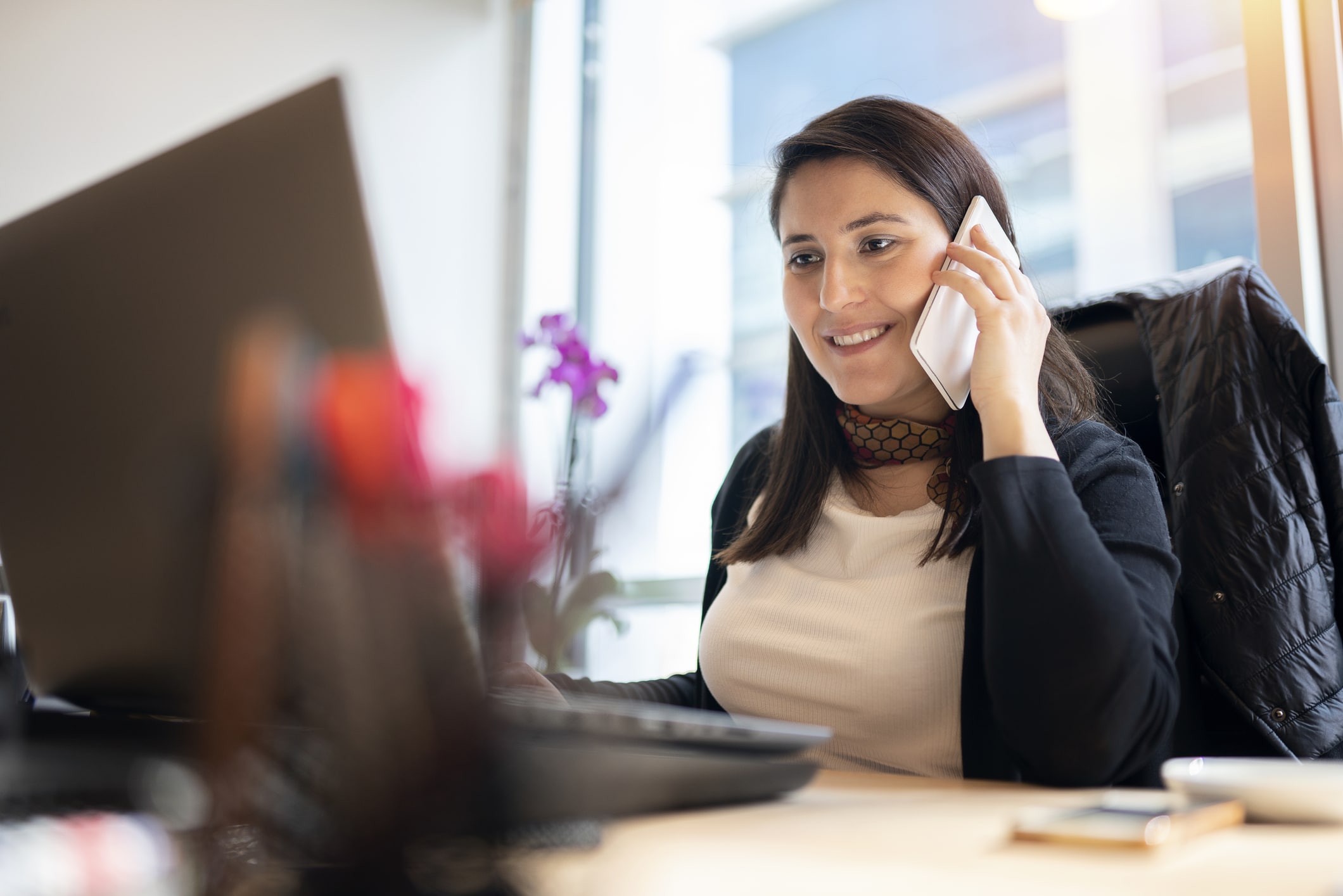 a woman sitting at a desk