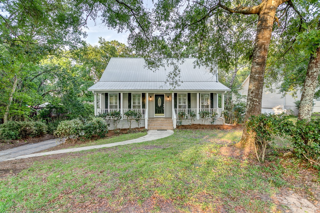 a tree in front of a house