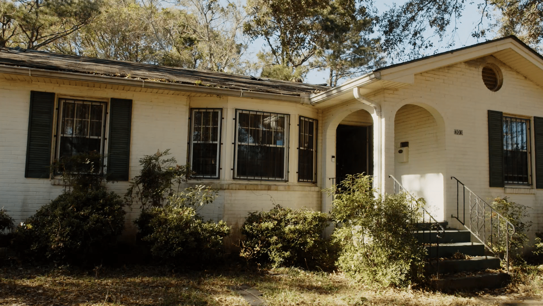 a house with trees in the background