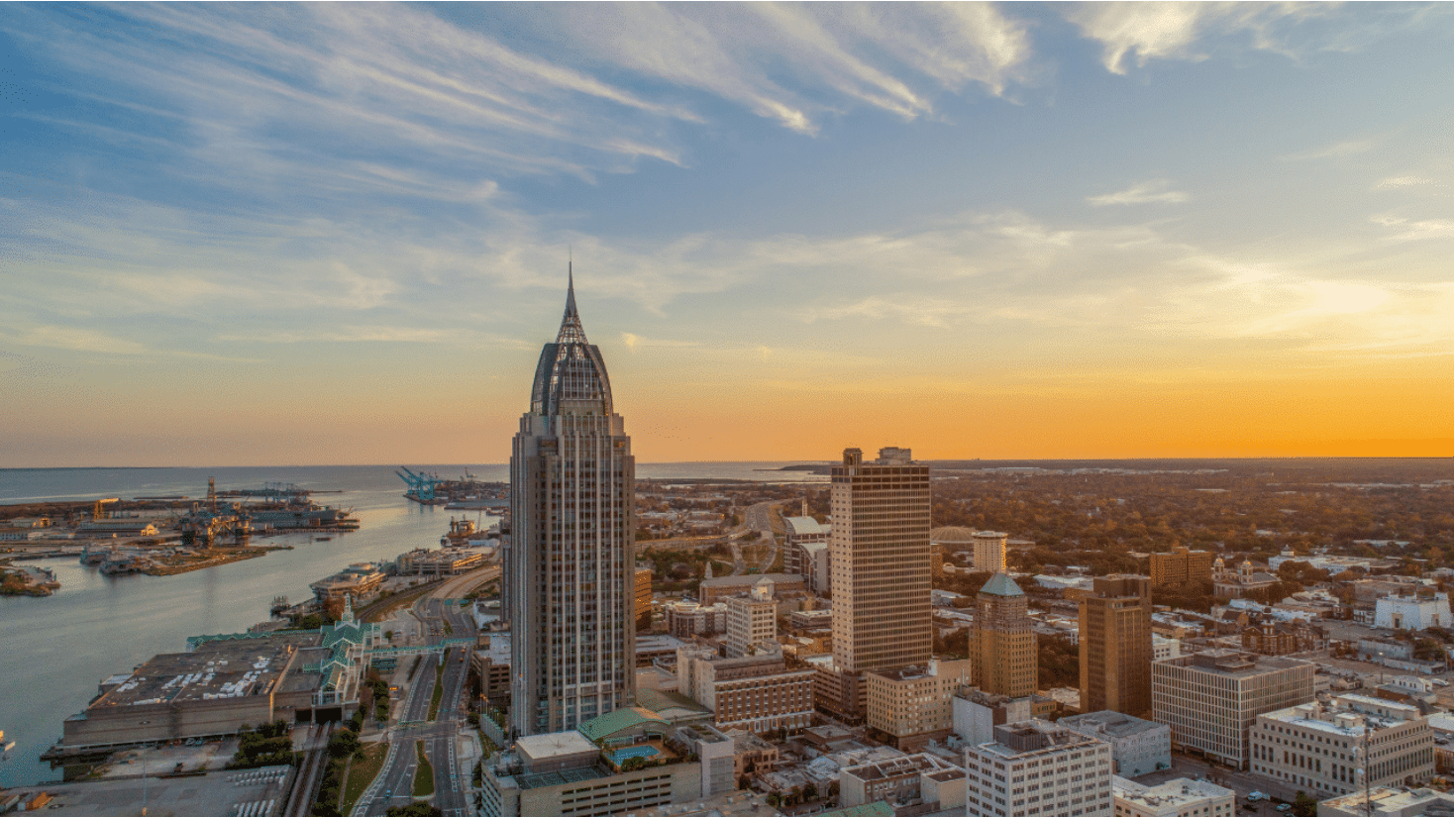 a body of water with a city in the background